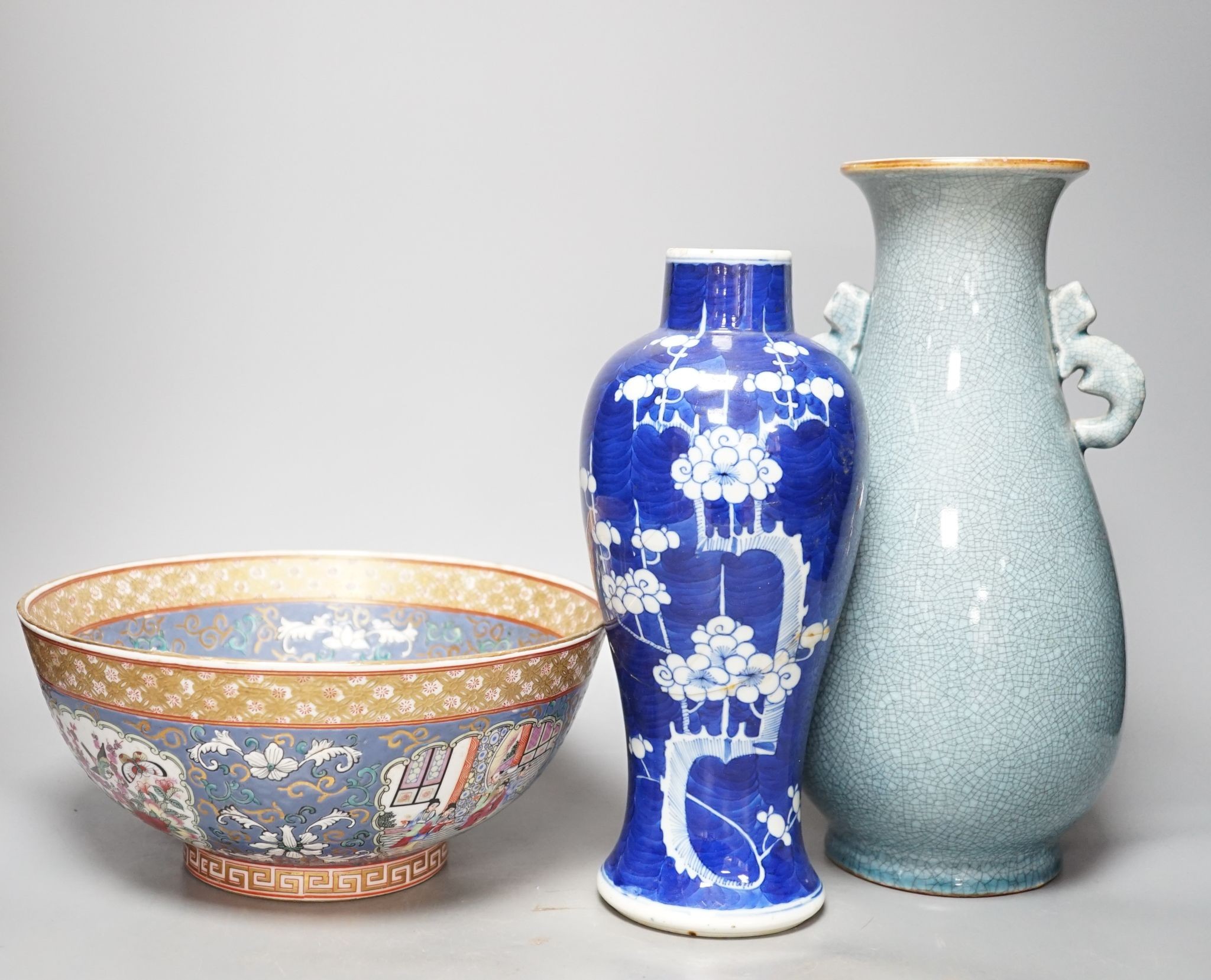 A Chinese blue and white Prunus vase, a Chinese enamelled porcelain bowl and a pale blue crackle glaze vase, tallest 32 cm